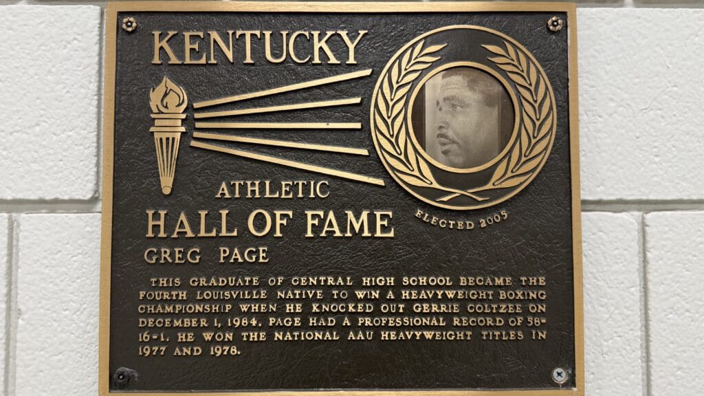 a plaque with a picture of a man in the center