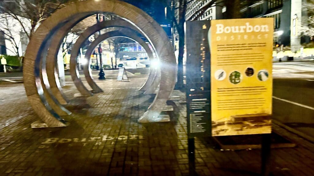 a group of arches on a brick sidewalk