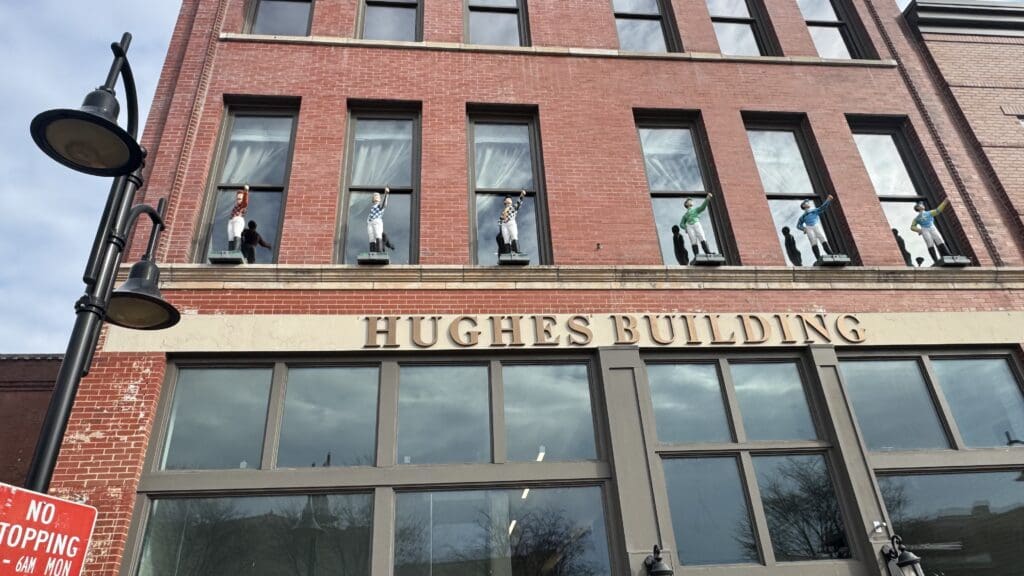 a group of people cleaning windows of a building