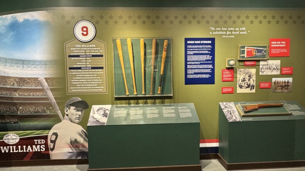 a display of baseball bats and signs