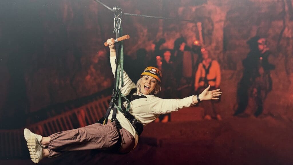 a woman in a zip line